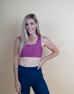 front view of active mum wearing pink rouched breastfeeding sports bra