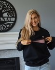 Zip function of a breastfeeding crew sweatshirt