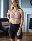 Pocket functionality of black postpartum bike shorts