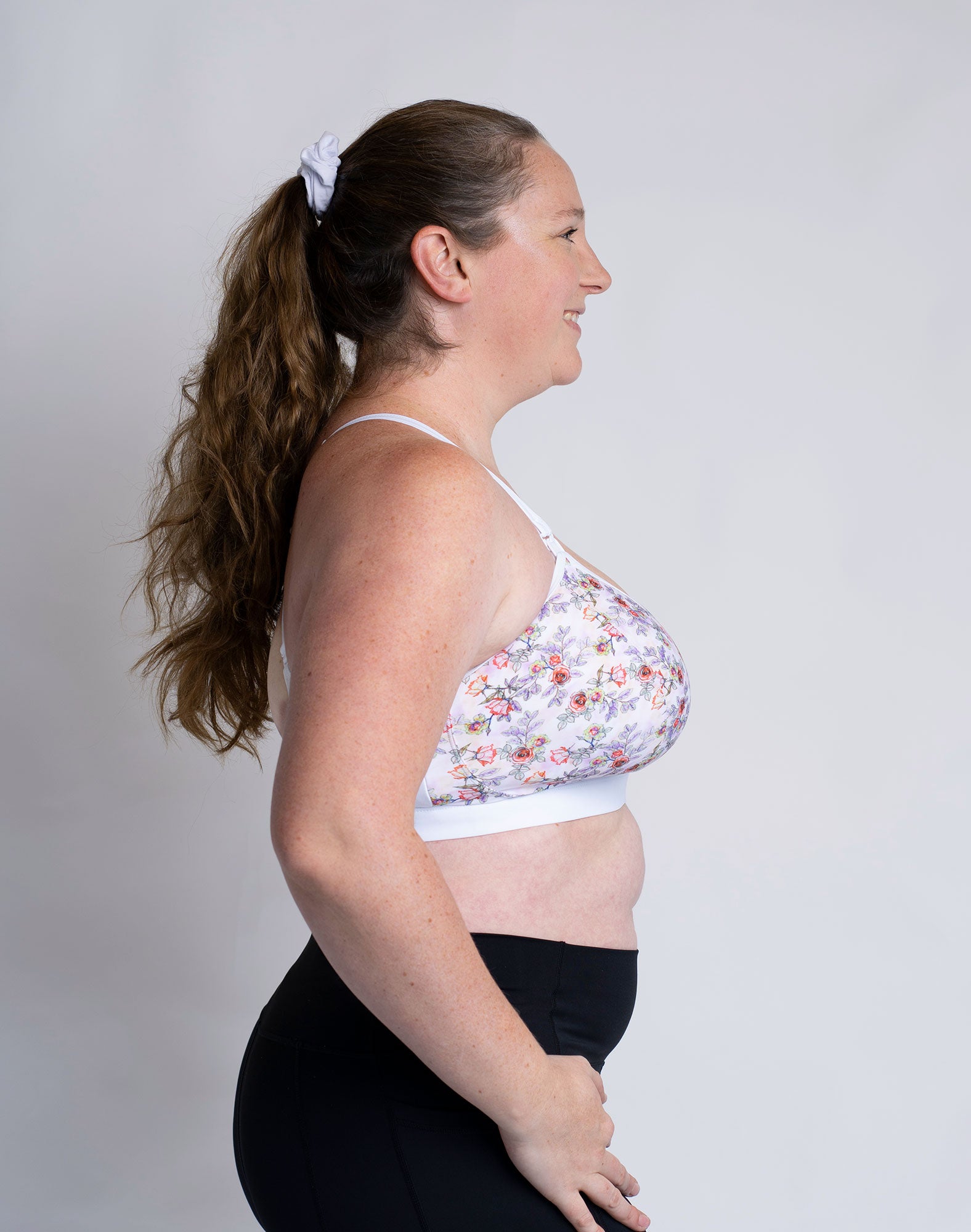 Side view of mum wearing floral print large cup size nursing bra
