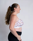Side view of mum wearing floral print large cup size nursing bra
