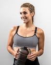 active mum training in a black and white striped maternity activewear bra
