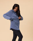 mother demonstrating the nursing function of a nursing hooded sweatshirt