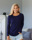 happy, fit mother wearing blue bamboo long sleeve top