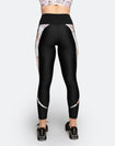 back view of high waisted black postpartum compression tights with white floral detailing
