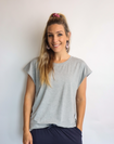 active happy mum wearing a relaxed fit grey tee with wide armholes for breastfeeding