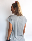 back view of active mum wearing a relaxed fit grey t-shirt with wide armholes for breastfeeding