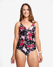 Happy mum wearing on piece maternity swimsuit in floral print