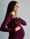 Pregnant mother showing the nursing function of a burgandy long sleeve top