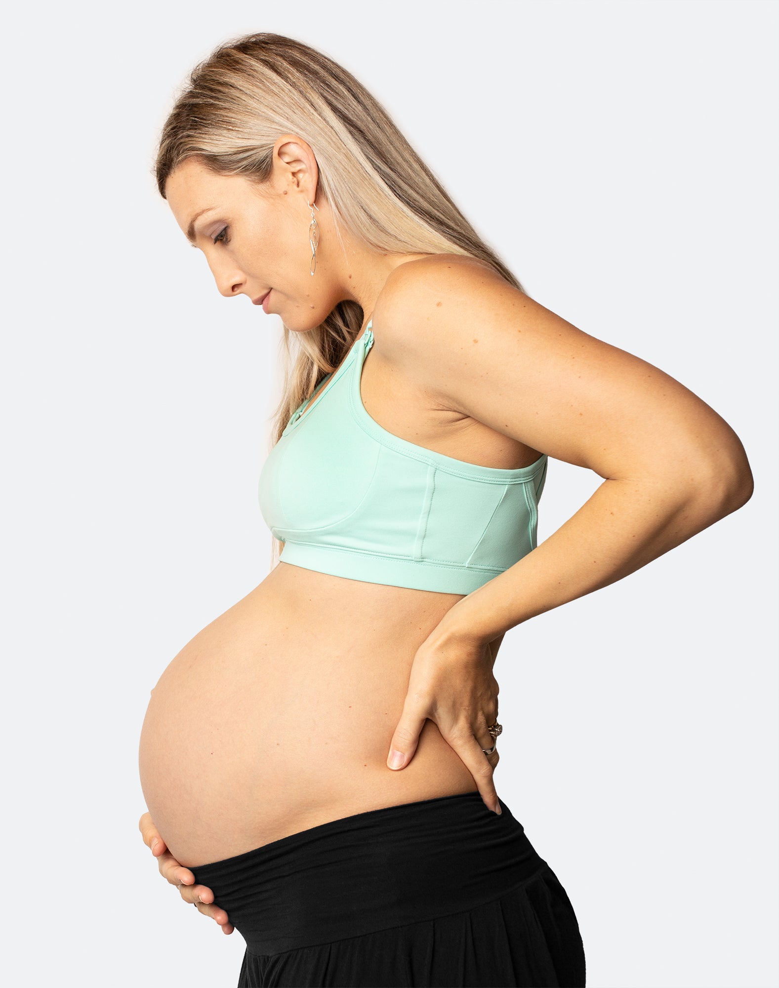 pregnant woman wearing a colourful racerback nursing bra