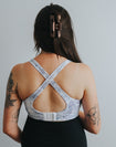 back view of a pretty print crossover nursing sports bra