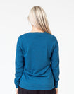 back view of a mum in a navy maternity top with long sleeves