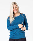 active mum wearing a navy maternity top with long sleeves and invisible zips for breastfeeding