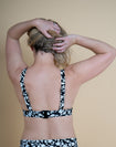 Back view of model wearing nursing bikini top