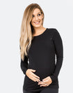 back view of a pregnant lady wearing a black maternity top with long sleeves