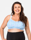 happy pregnant woman wearing her a supportive nursing bra