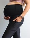 Pregnant mother wearing high waisted maternity leggings in black