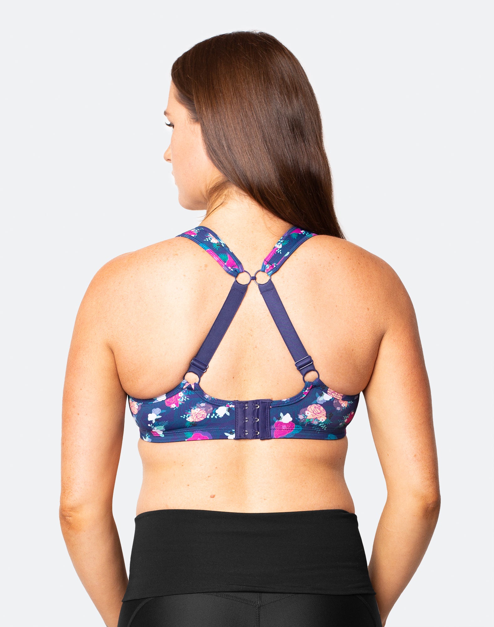 back view of active woman wearing a nursing sports bra in racerback 